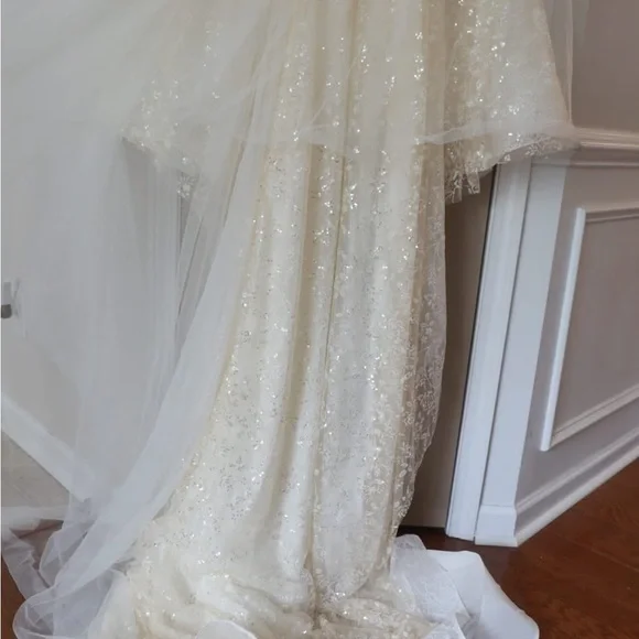 This wedding dress is a size 20. Brand New and had never been worn before.